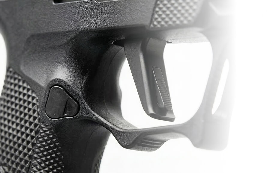 Close-up of a handgun trigger and grip texture detail